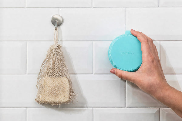 Solid soap bar in the Handso holder while lathering
